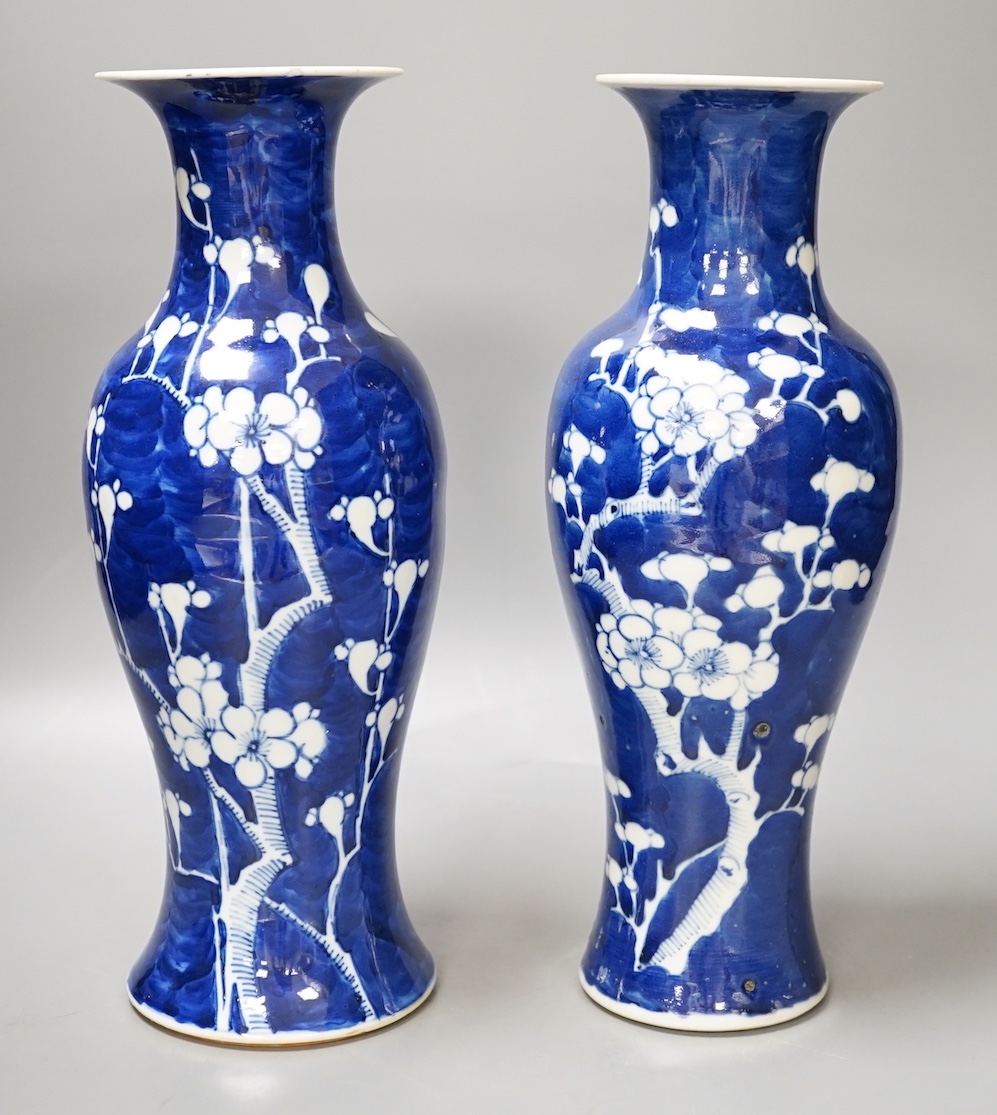 Two 19th century Chinese blue and white prunus vases, 31cm